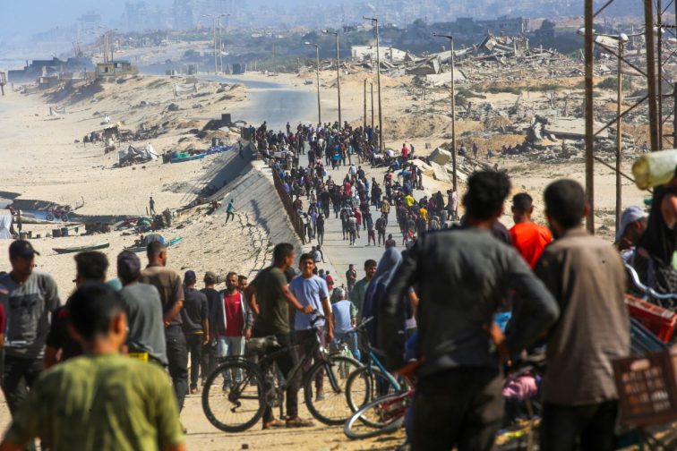 An image of Palestinians gathering on a street in Nuseirat in the central Gaza Strip